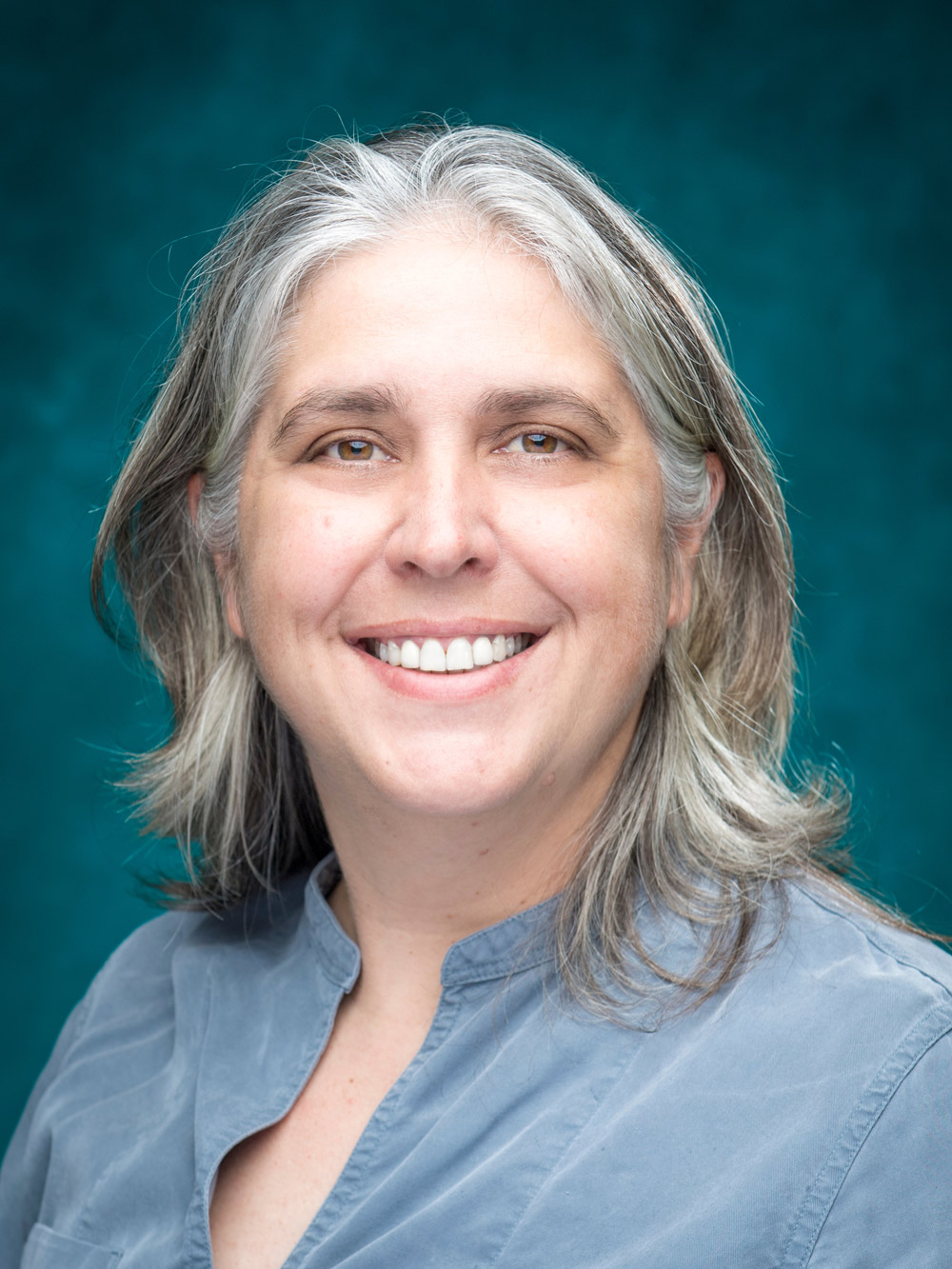 Portrait of Feletia Lee with Teal Background