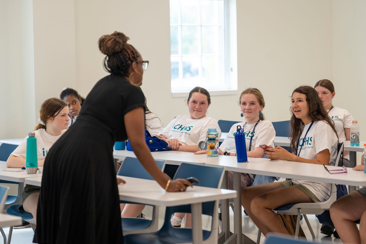 Student listening around table