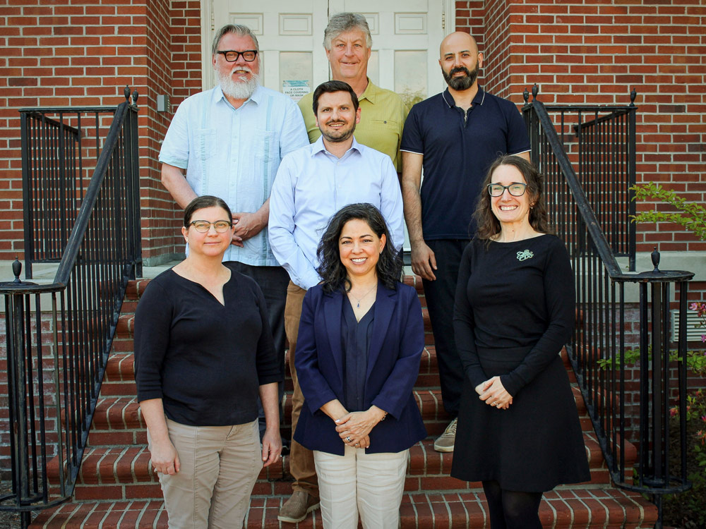 Anthropology faculty in front of a building