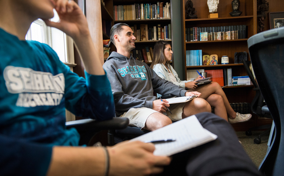 students learning in a classroom with computers.