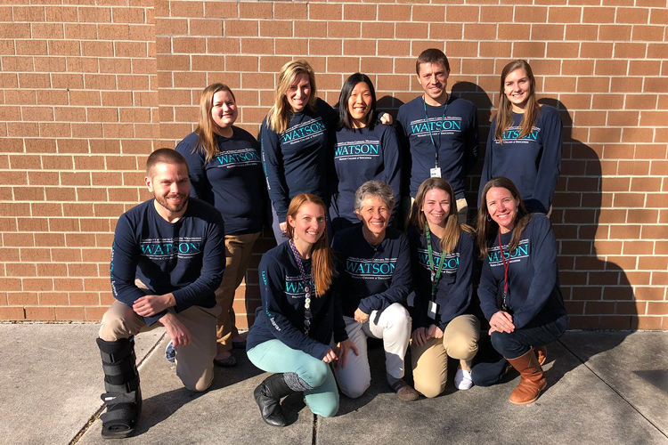 Interns for Watson smile for camera