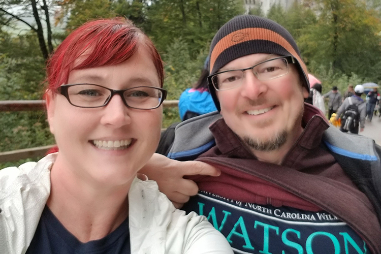 two people smiling at the camera