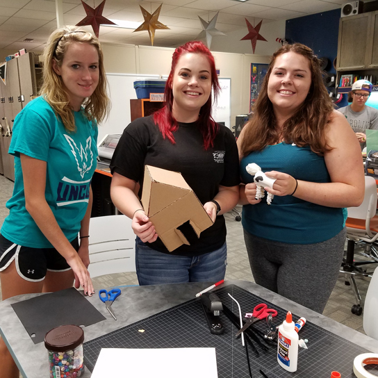 Students working on projects in the Curriculum Materials Center