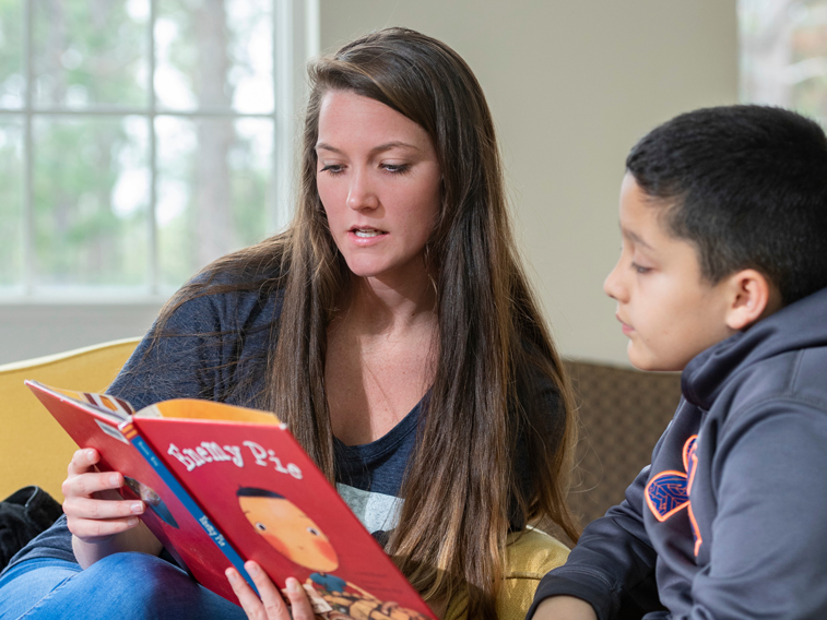 reading a book to youth