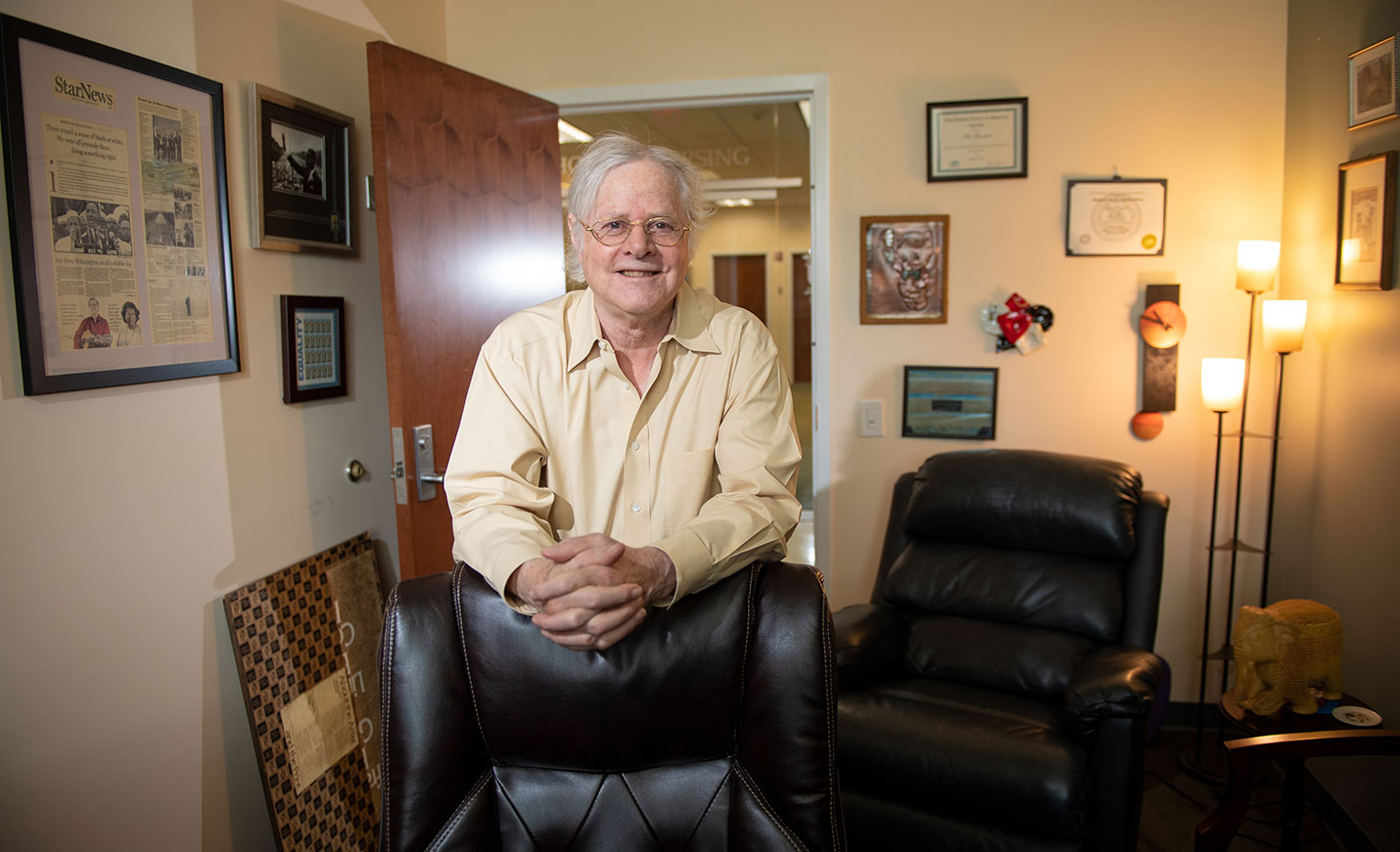 Art Frankel standing in his office.