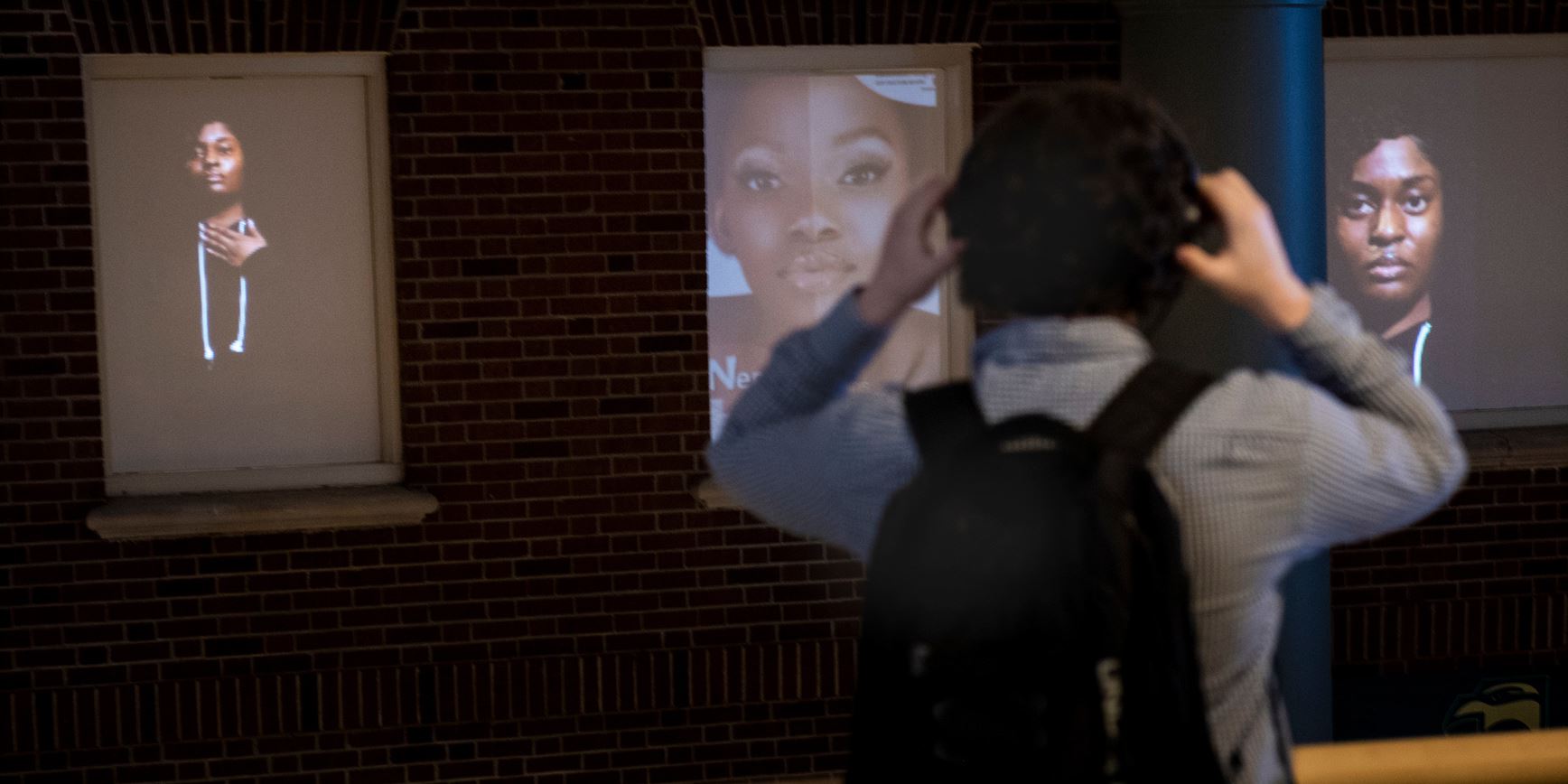 A student examines a multi-media art project 