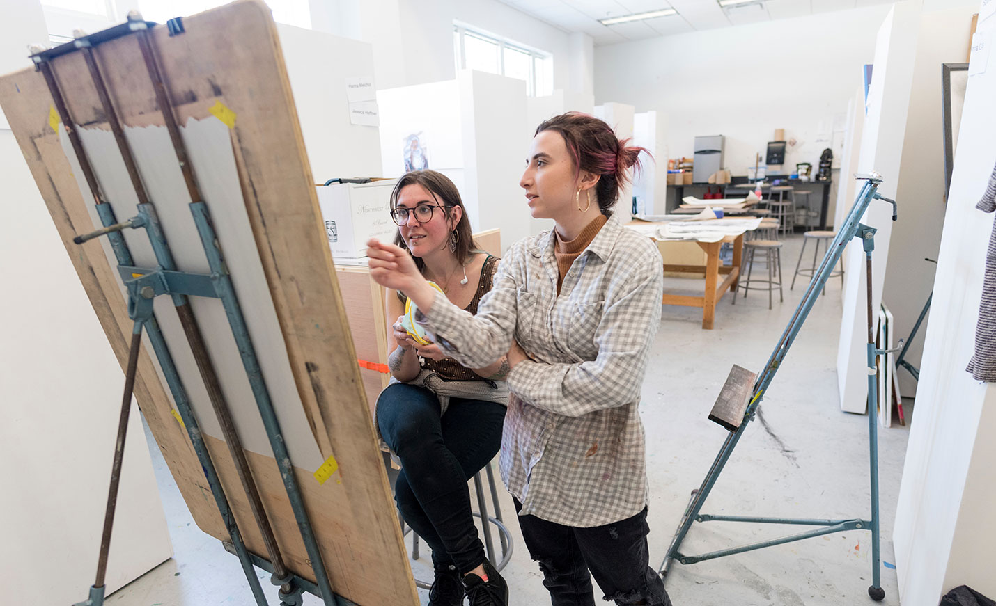 art students talking about a painting