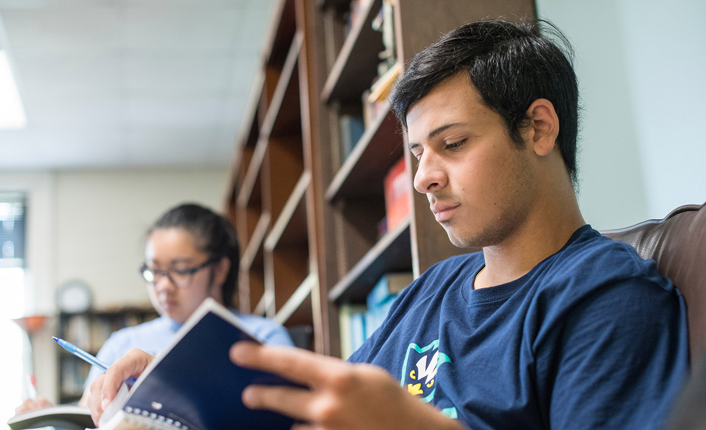 student reading in library