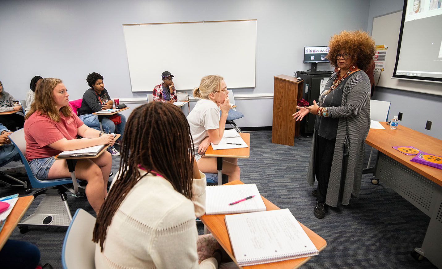 faculty lecturing at an interactive poetry class