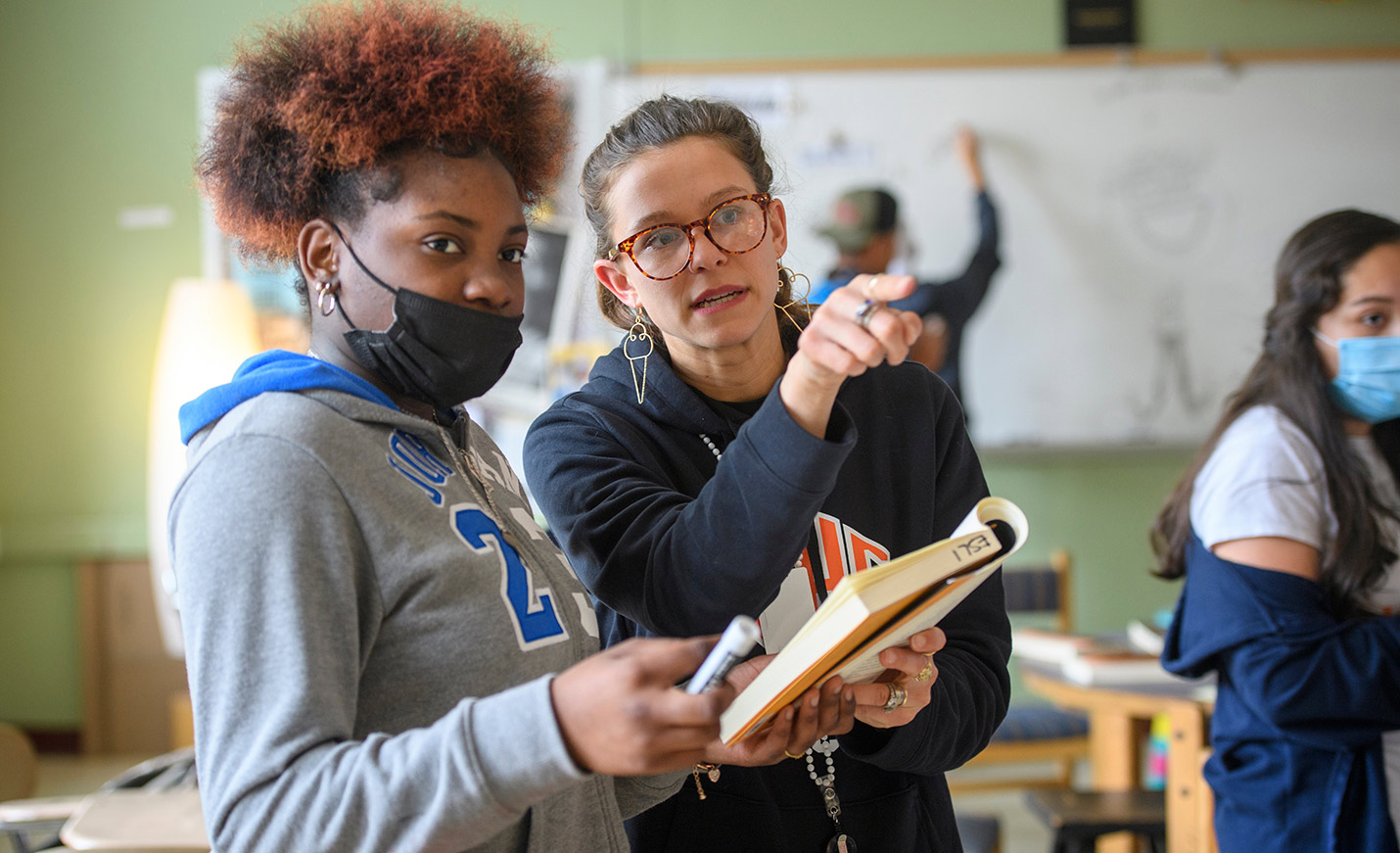faculty member talking with student