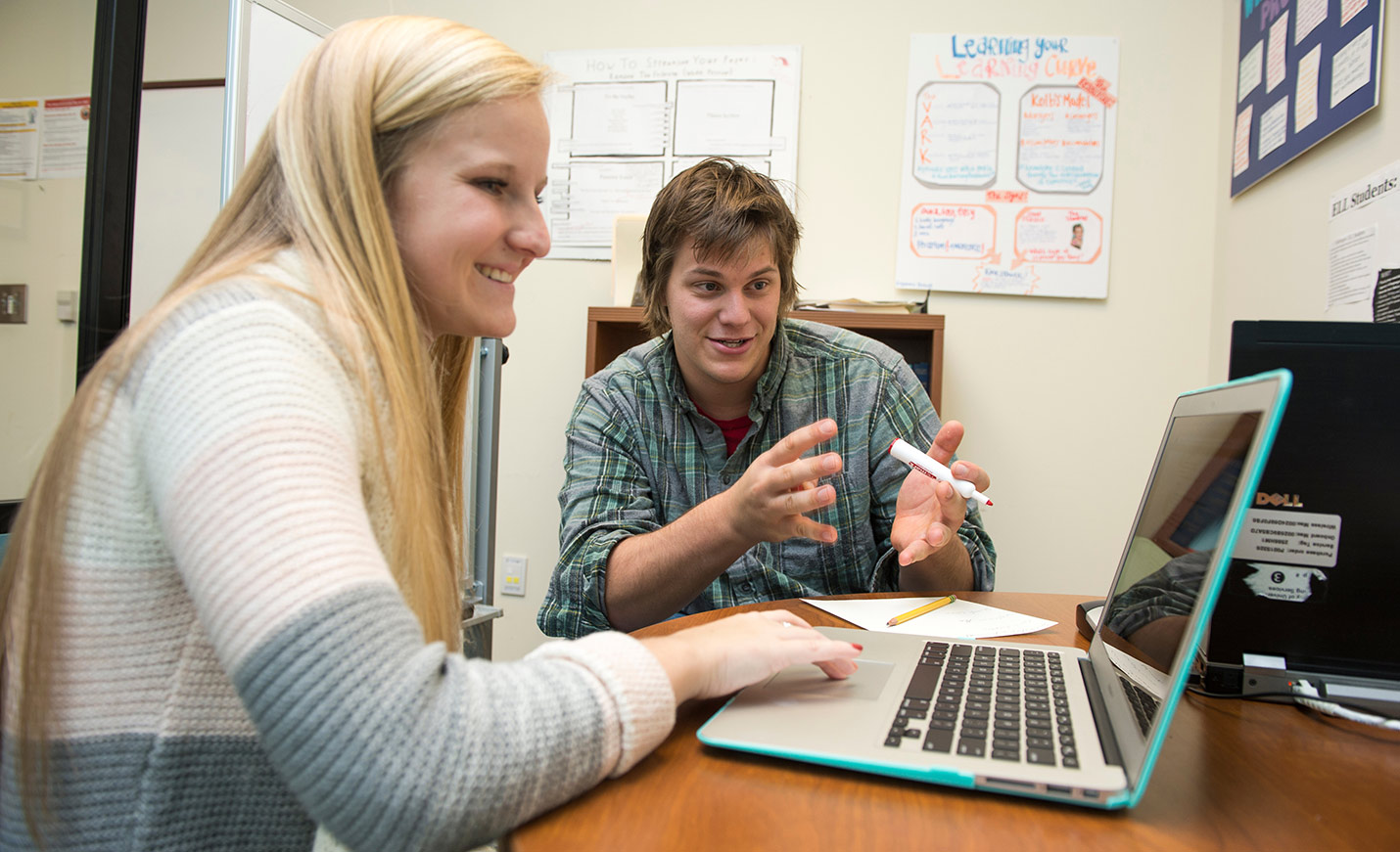 two students at laptop