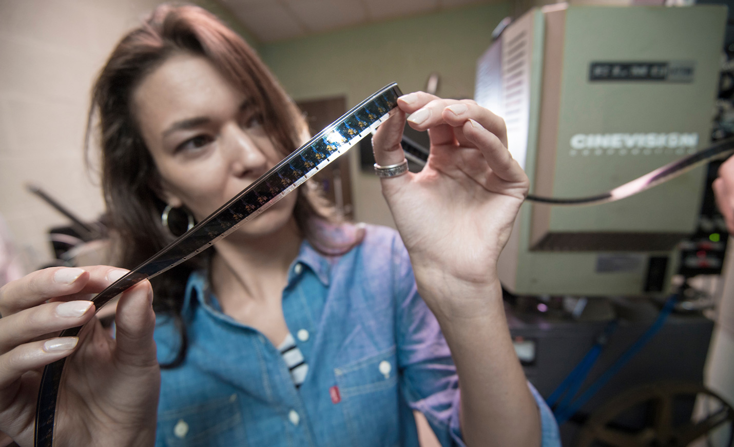 Student looking at film