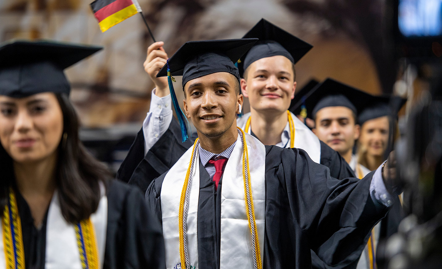 diverse students at graduation
