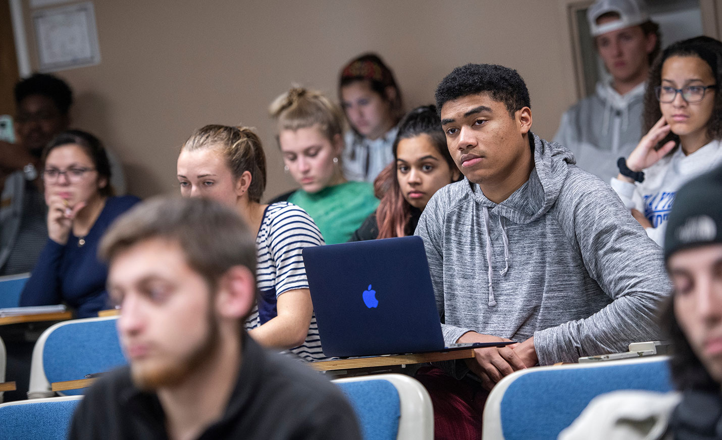 Students on laptops during a lecture