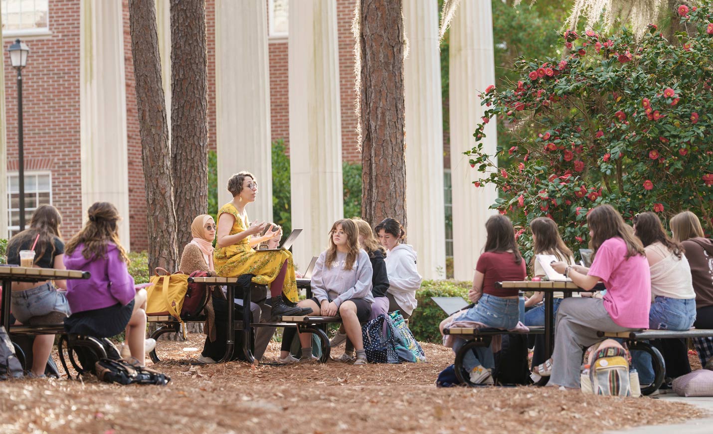 Professor teaching a class outside