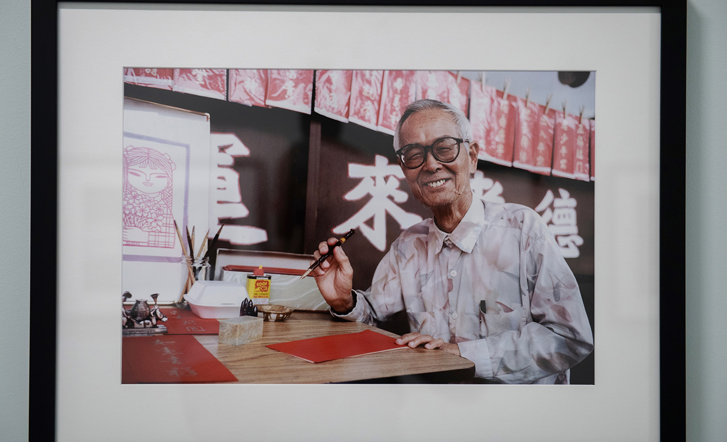 Smiling Japanese artist at work