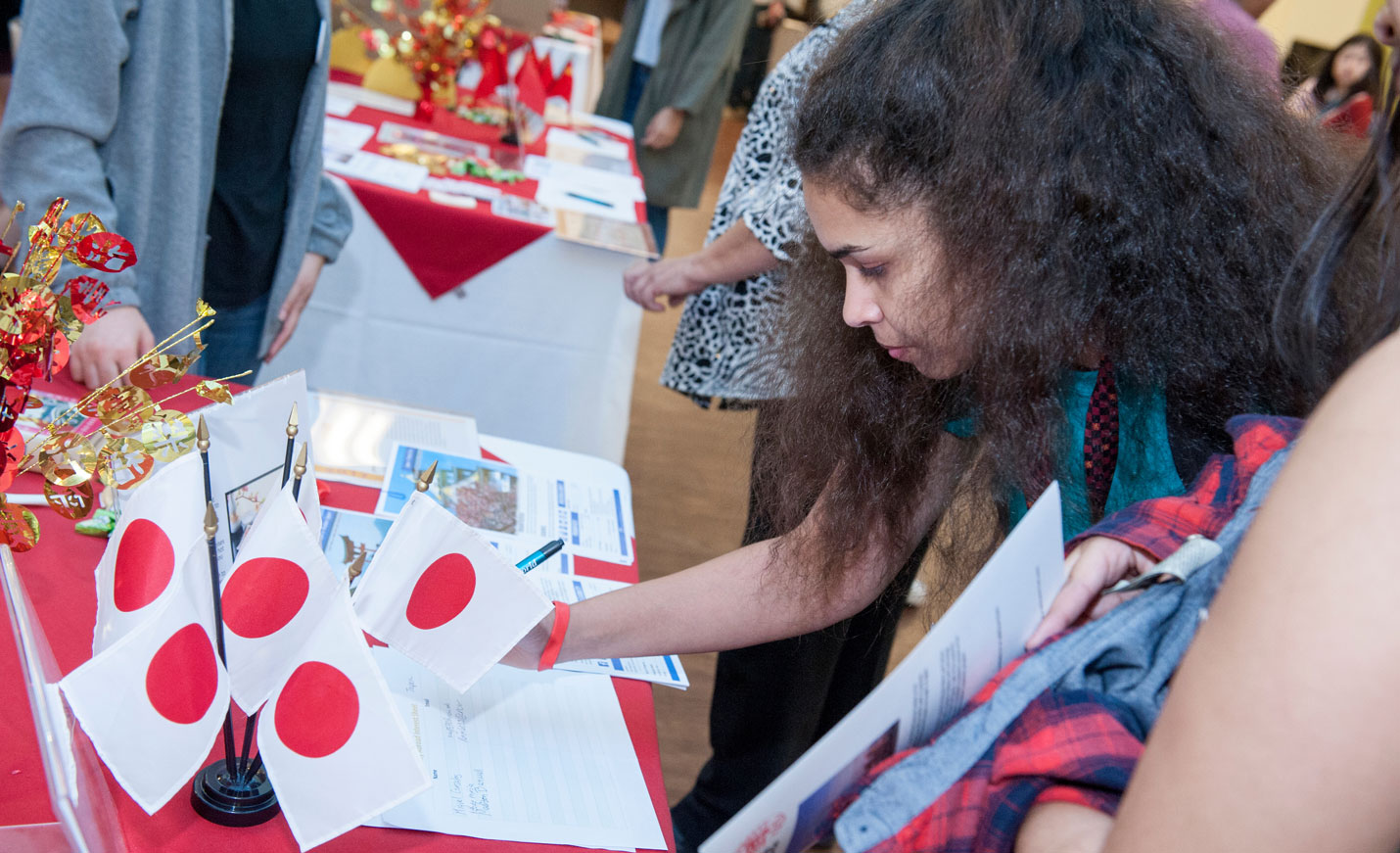 student with Japanese flags on a table 