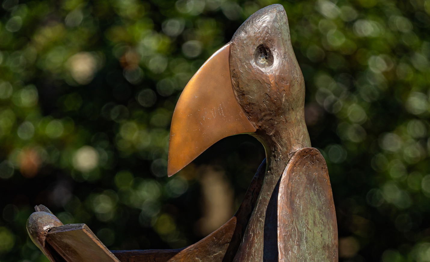 A close-up of the Seahawk reading sculpture that sits outside of UNCW Library