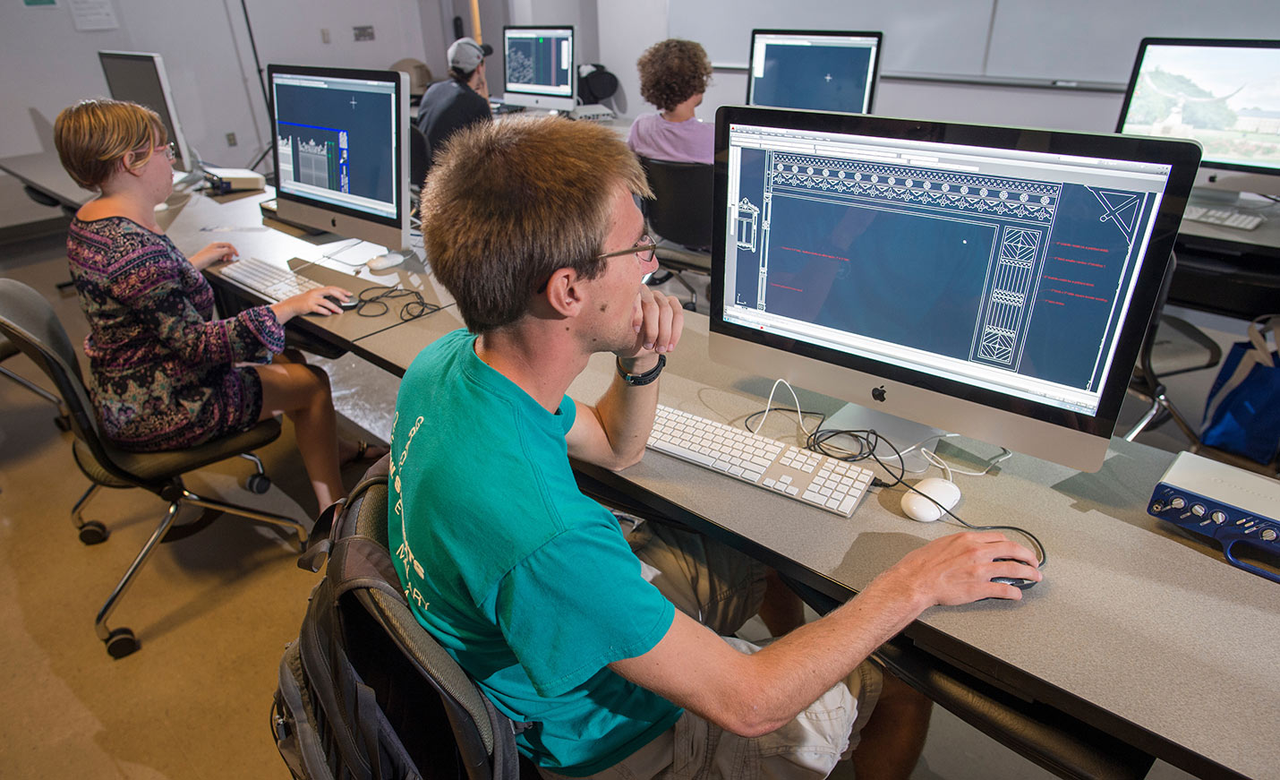 Students designing graphics on computers