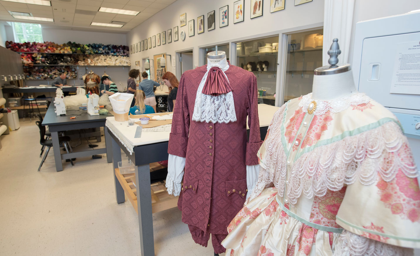Headless mannequins with colonial-style clothing hanging on them