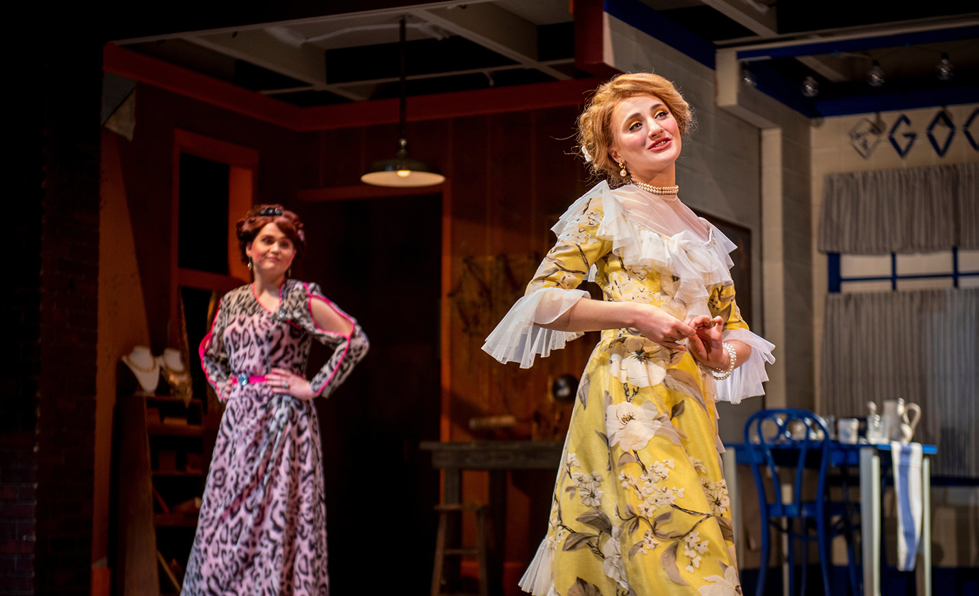 Two actresses in period dress onstage