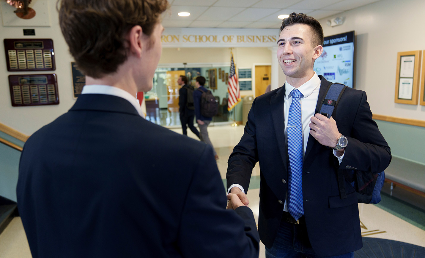 students shaking hands