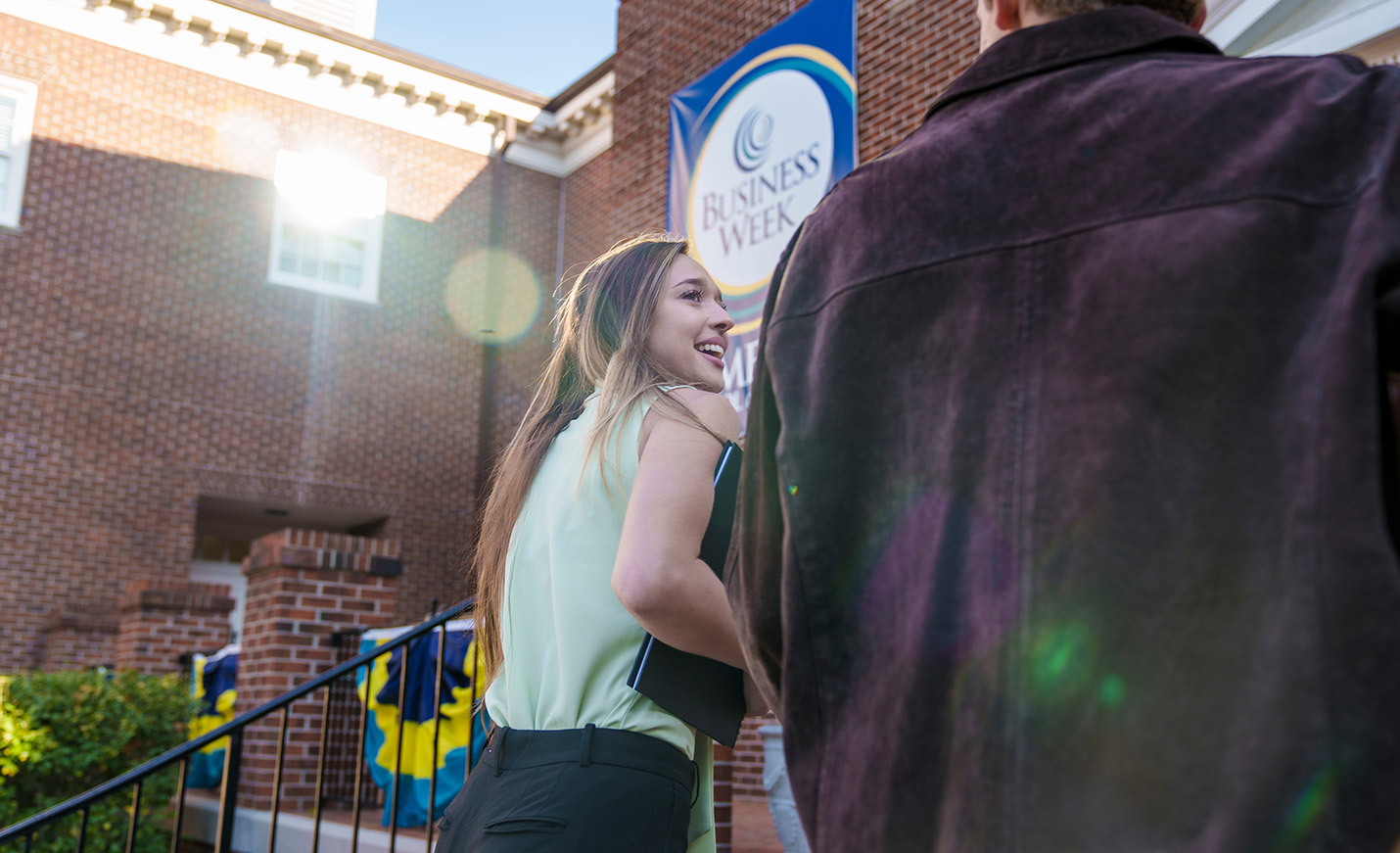 students walking into Cameron School of Business