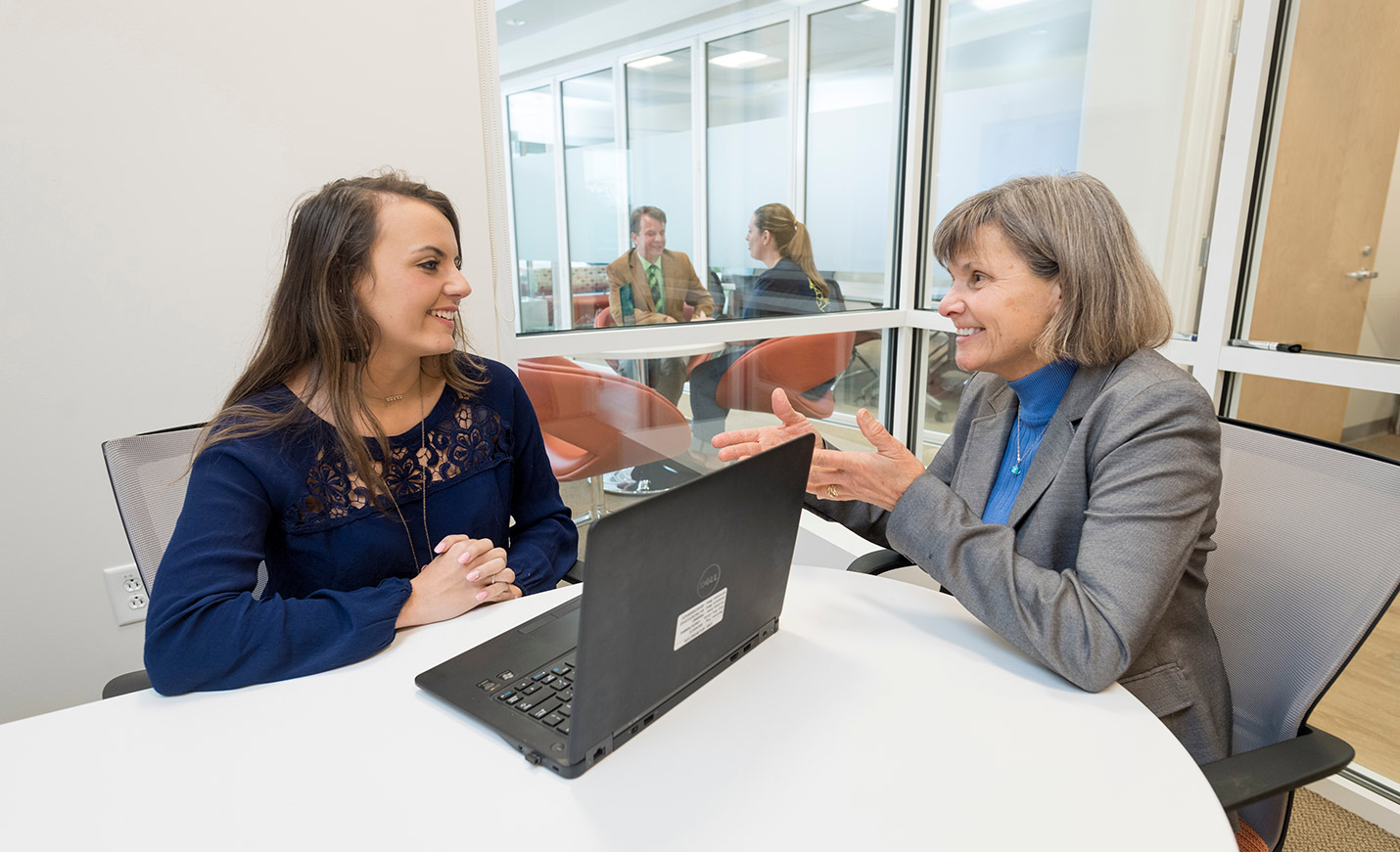 Professor speaking with a student