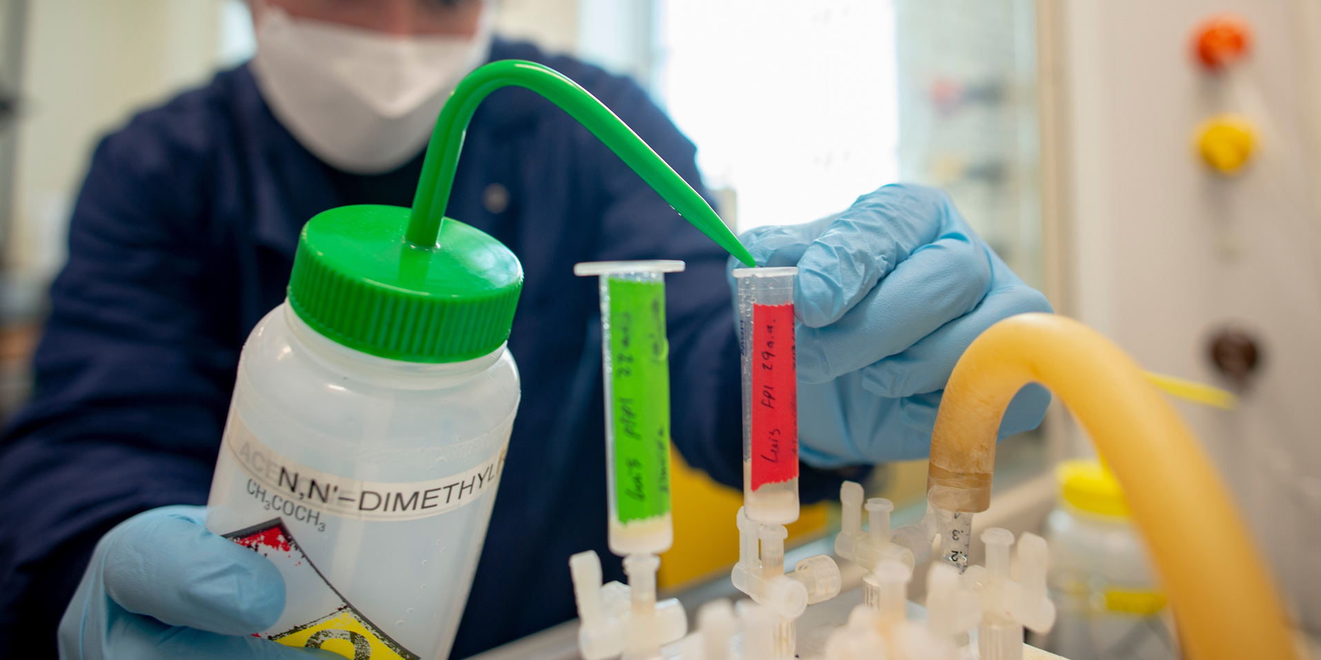 A student performing an experiment in a Chemistry lab