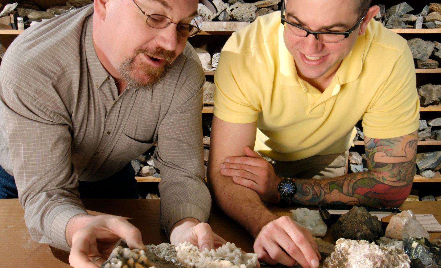 Teacher shows student a rock