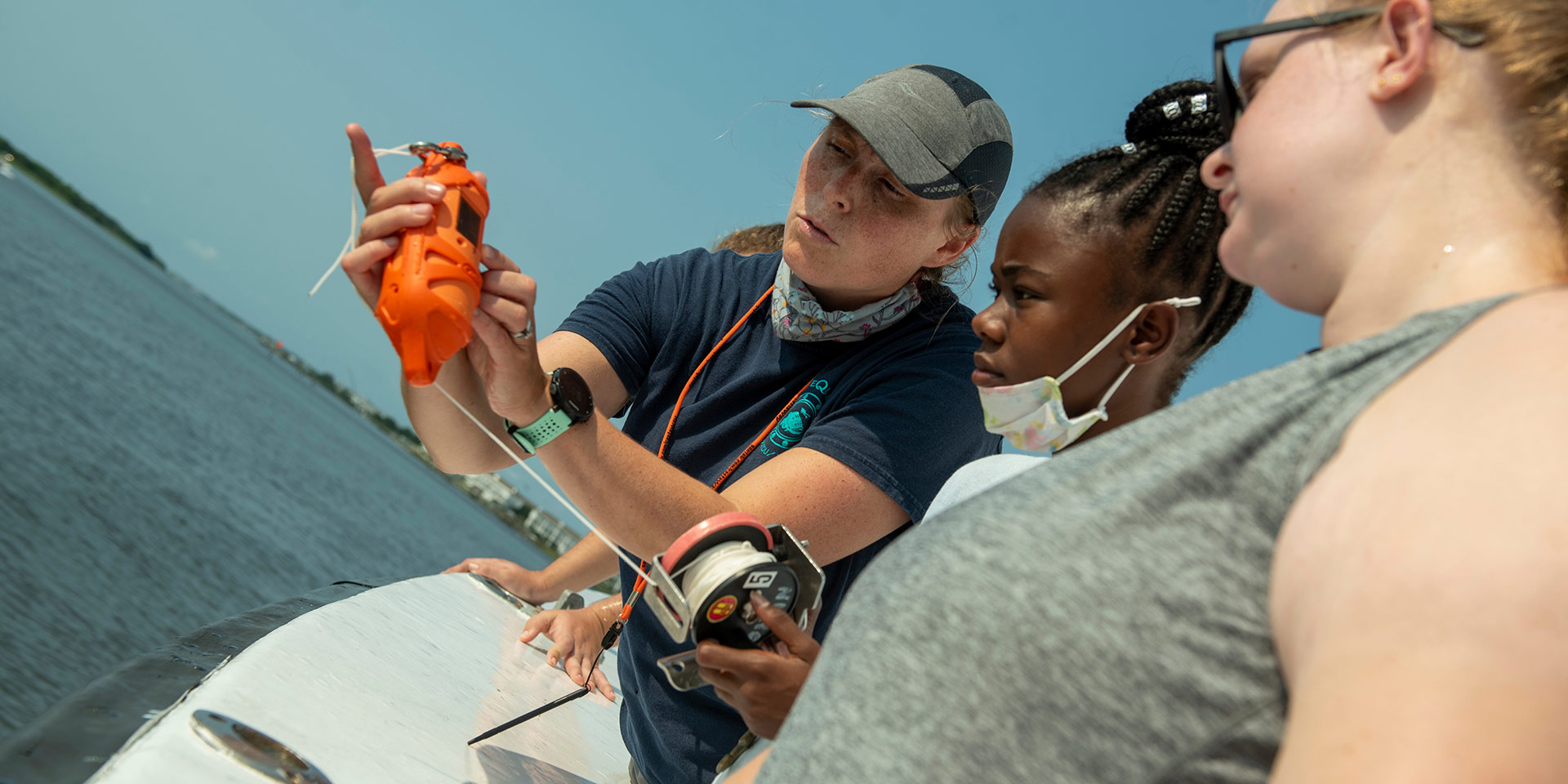 Students examine a water sample reading 
