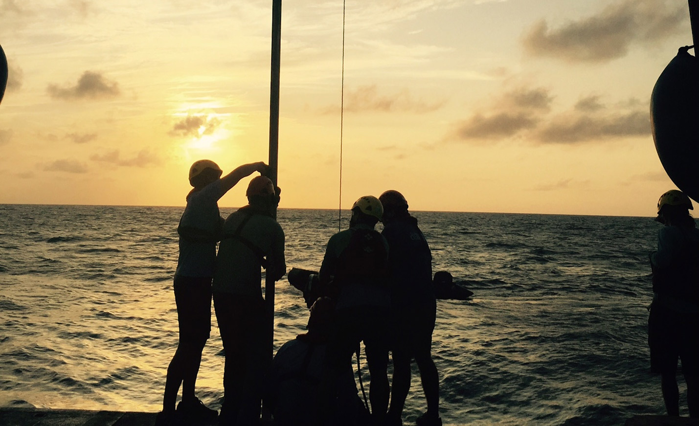 Working on a boat at dusk