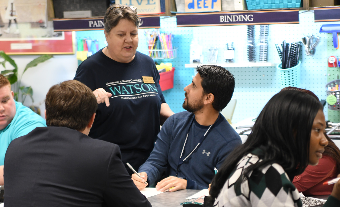 Instructor conducting a class in the Curriculum Material Center
