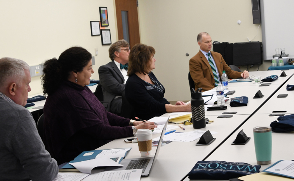 Watson stakeholders sitting at a conference table