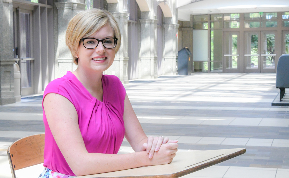 Portrait of Dr. Olivia Hall sitting a desk