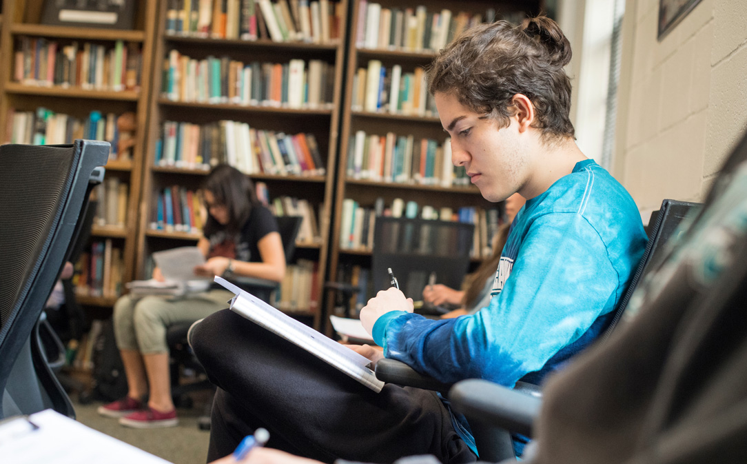 Students sitting in a class in the library