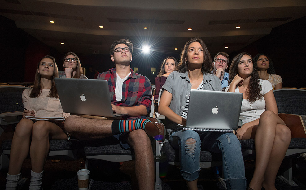 students learning in a classroom with computers.