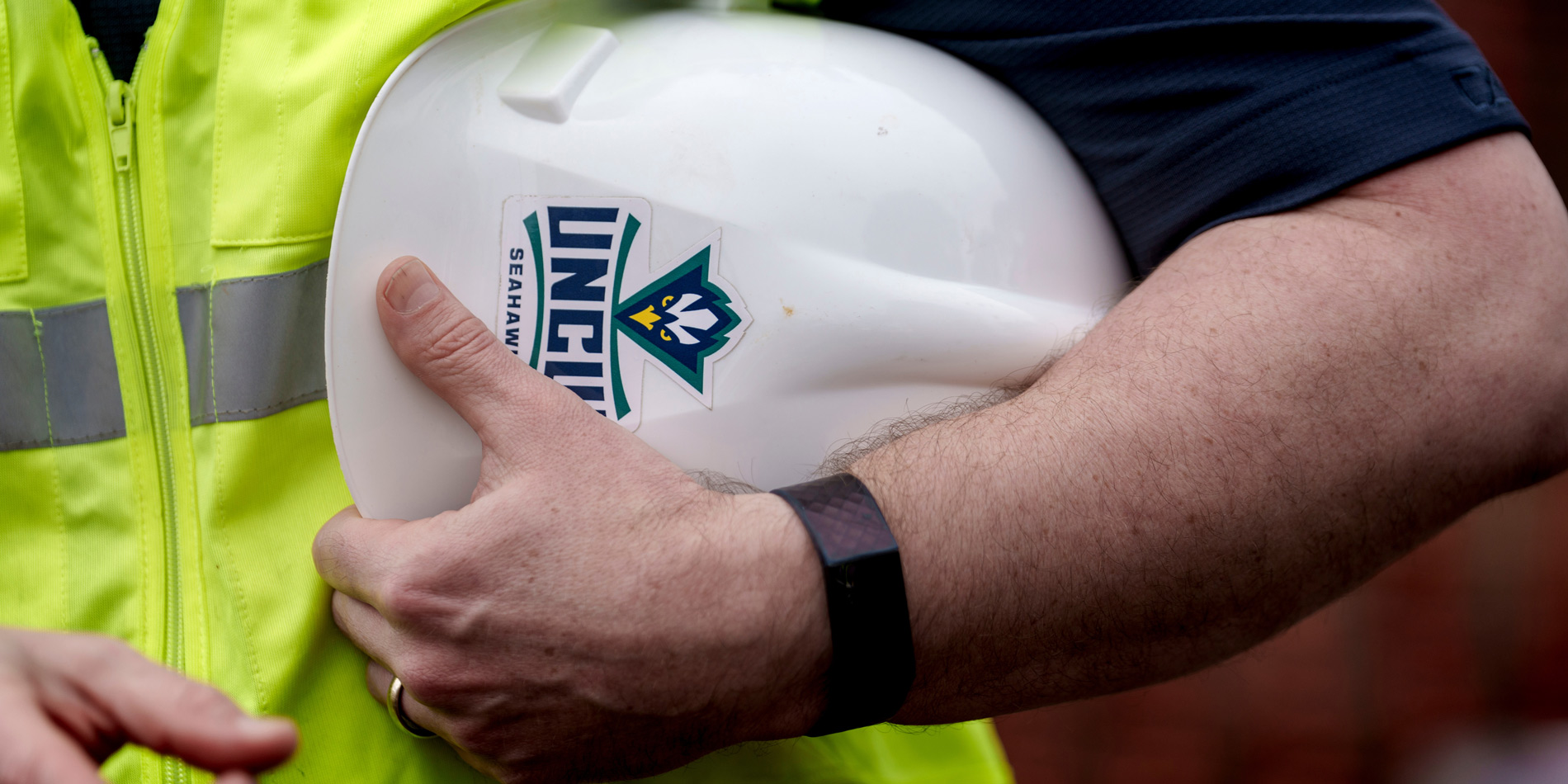 Worker holding hardhat
