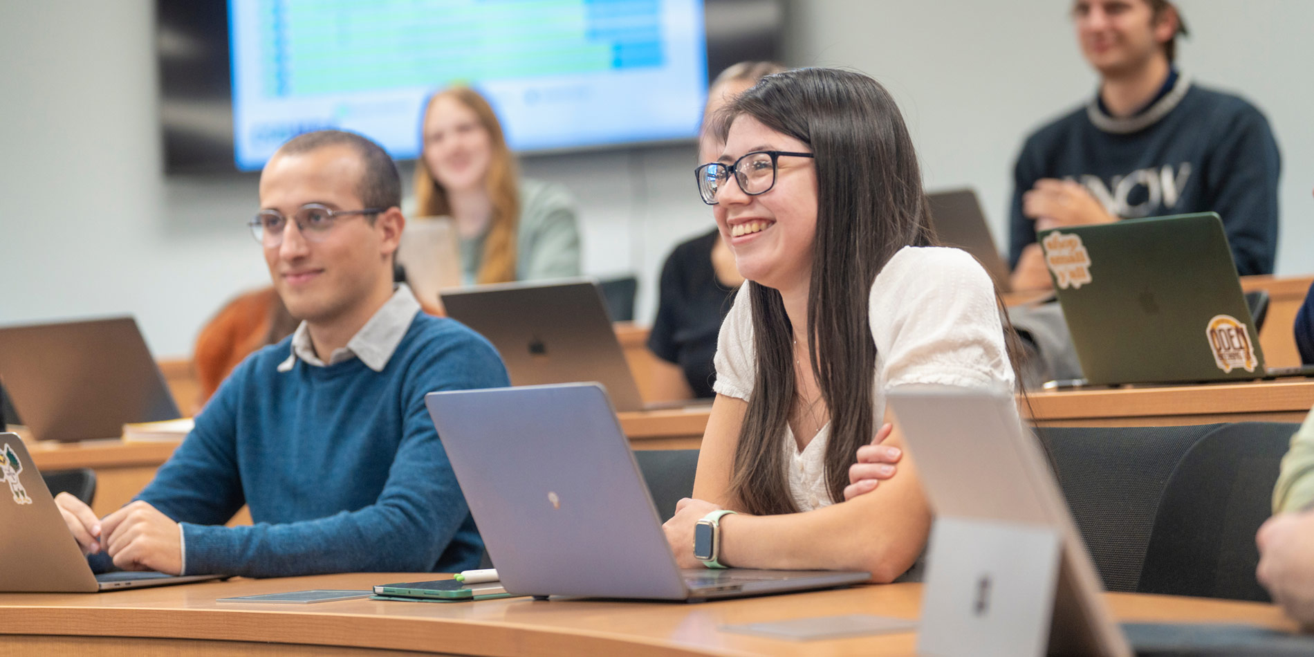 Students in classroom with laptops open