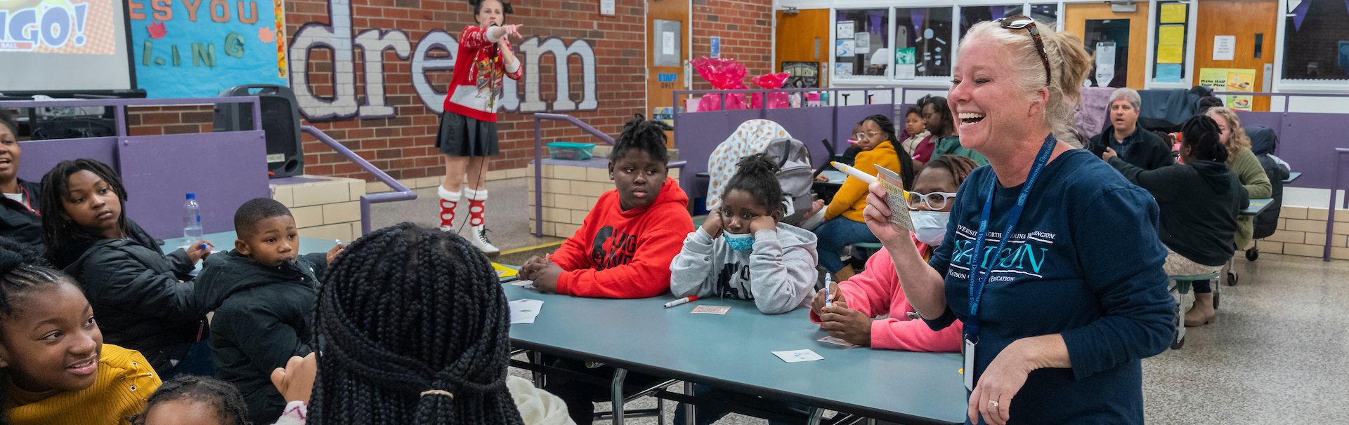 Families playing Bingo in cafeteria