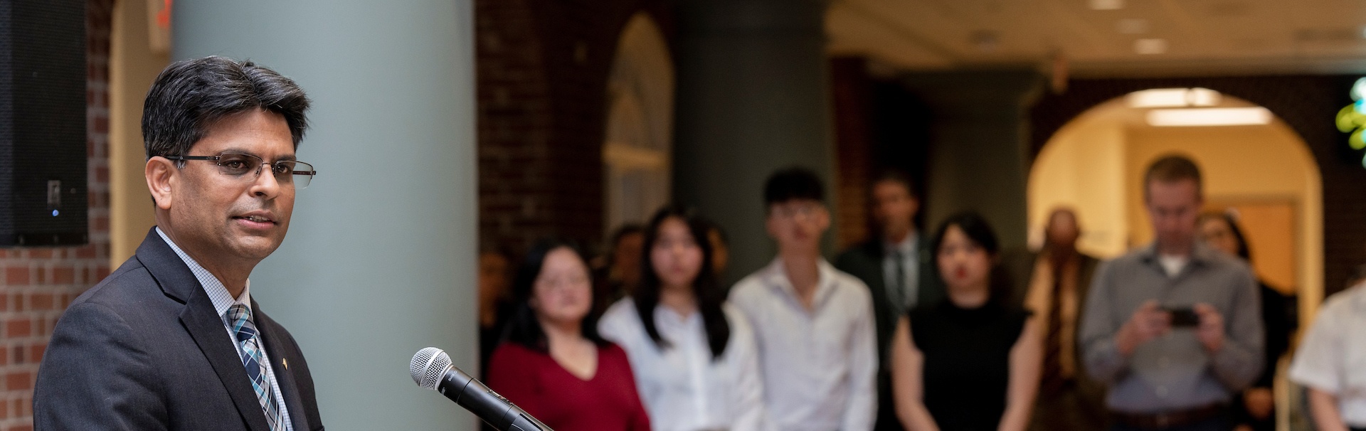 Chancellor speaks at podium for AHCC event