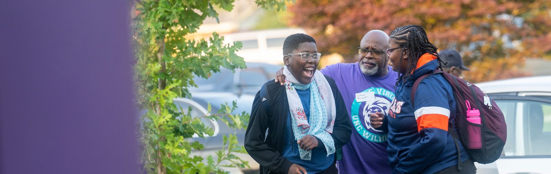 Teachers greet student on first day of classes