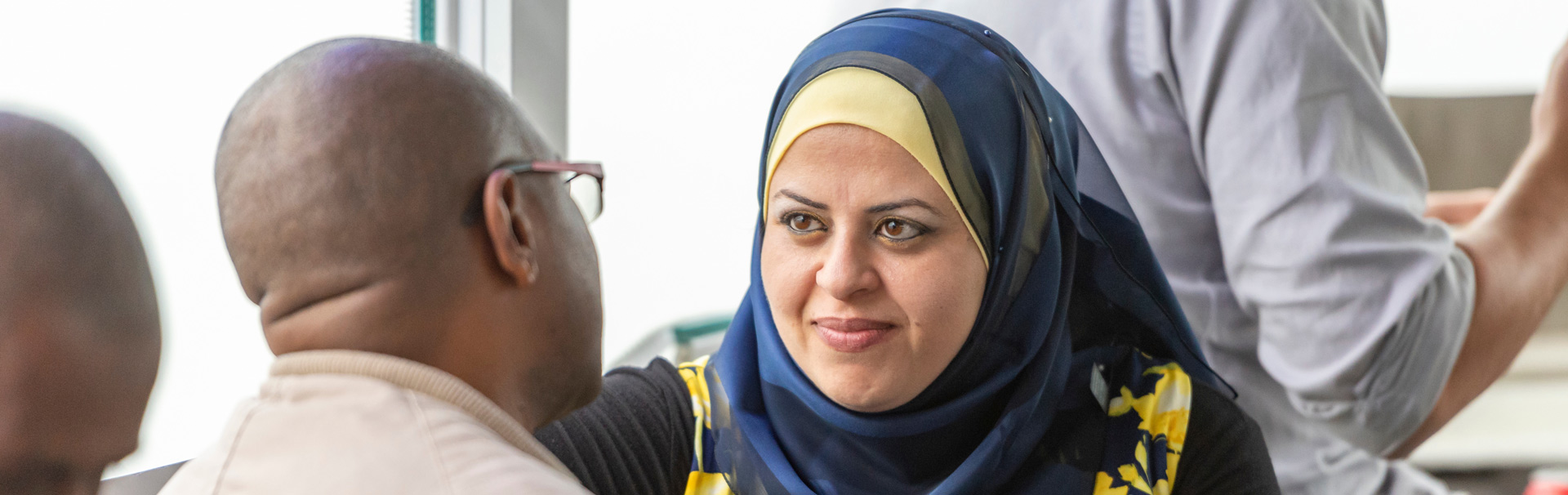 two people facing each other intently