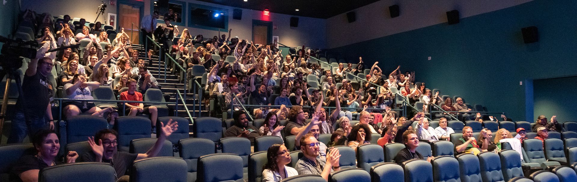 People gather in Lumina Theater to watch a movie