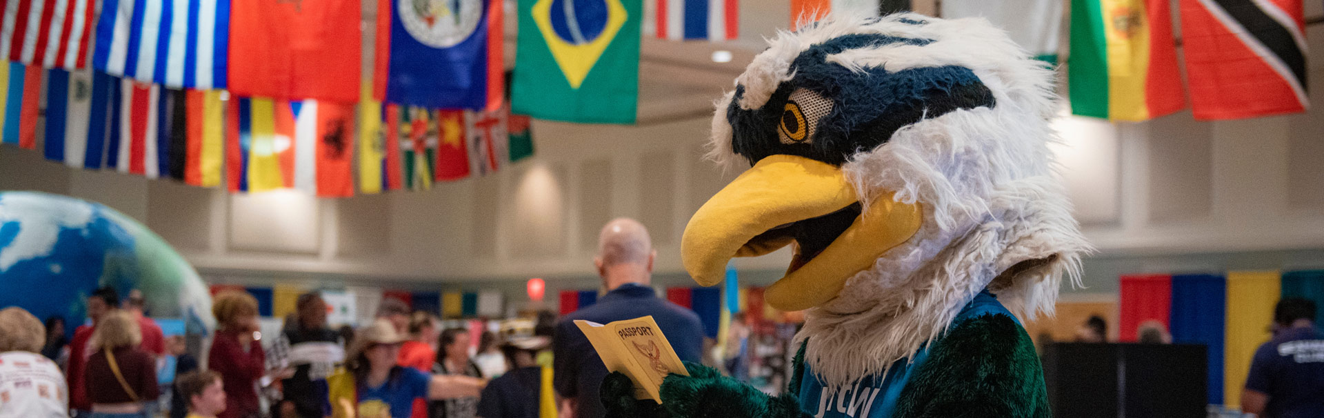 Sammy holding passport flags