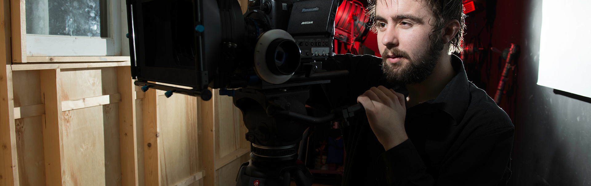 student working with a video camera