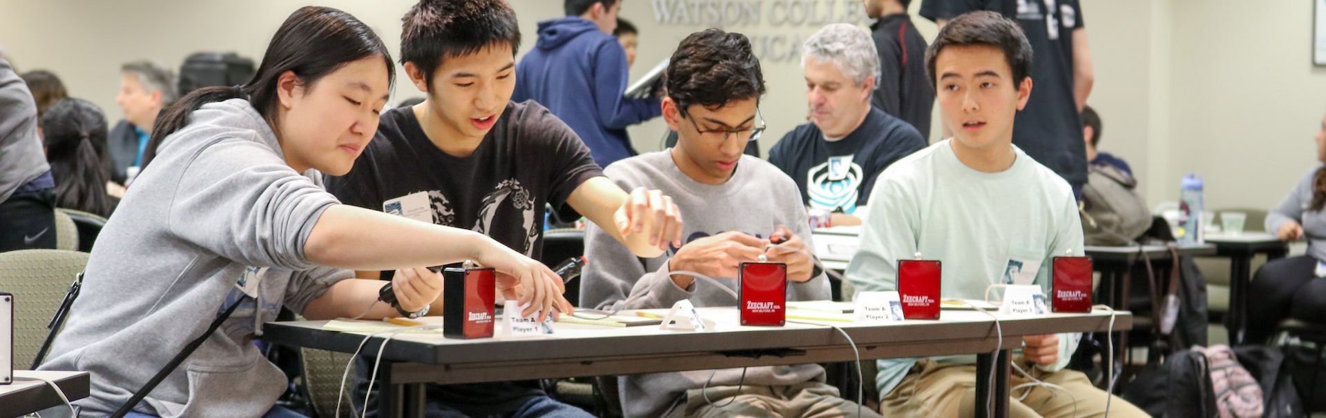 Students sitting at a table during Blue Heron Bowl