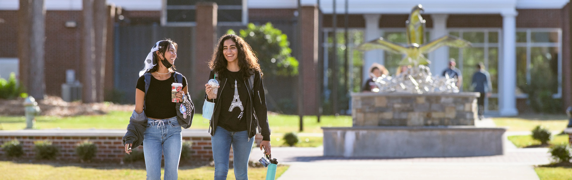 two girls walking in seahawk village