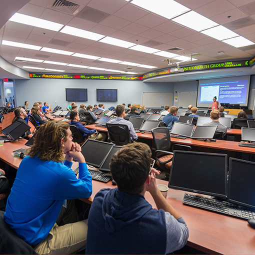 students learning in a classroom with computers.