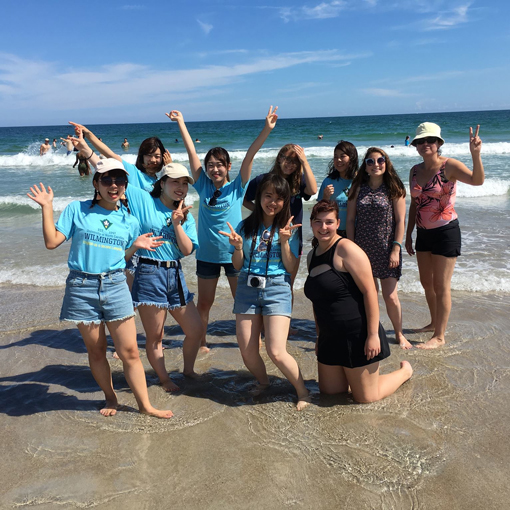Group posing on beach